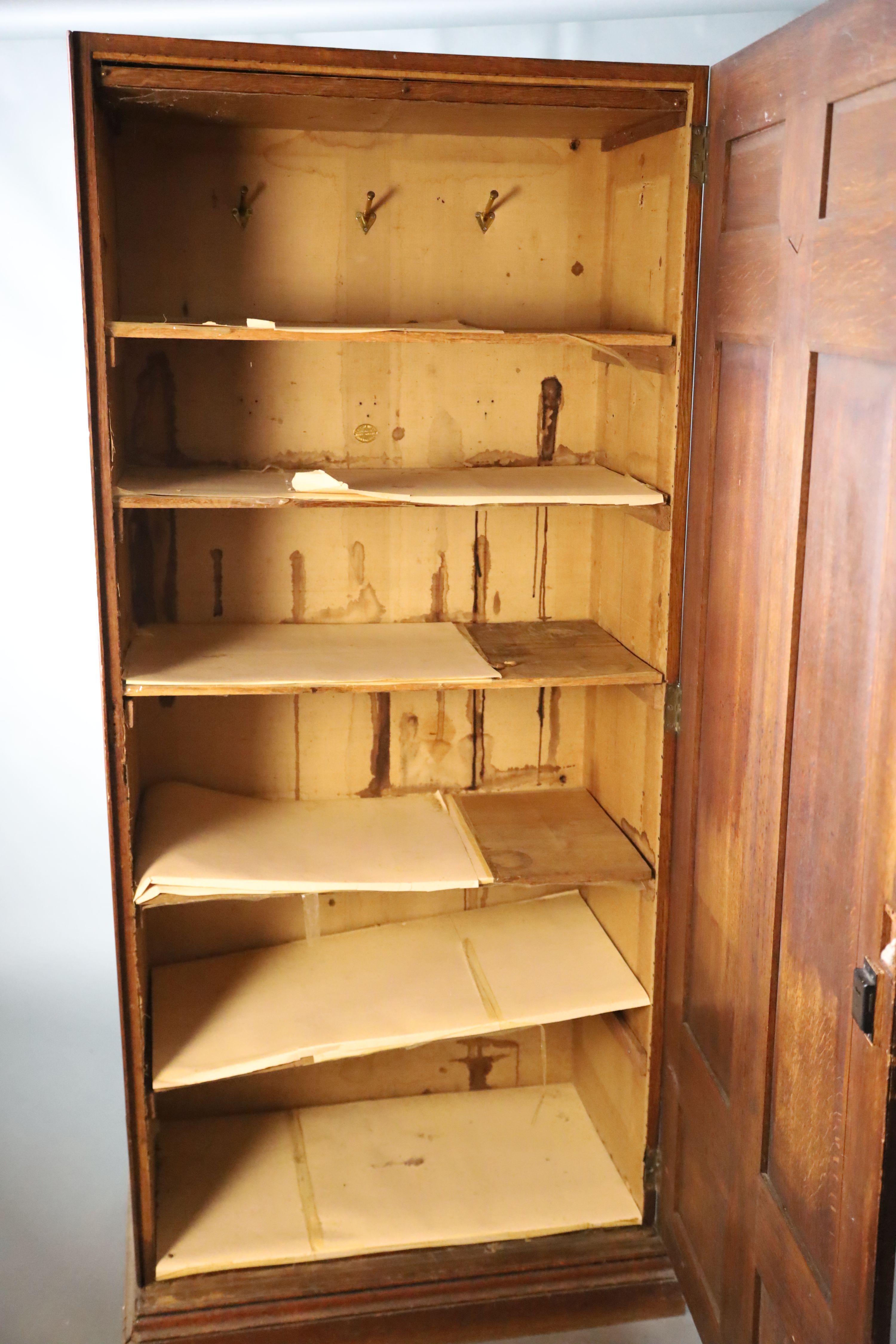 A late 19th century French oak hall cupboard, W.119.5cm D.51cm H.200.5cm